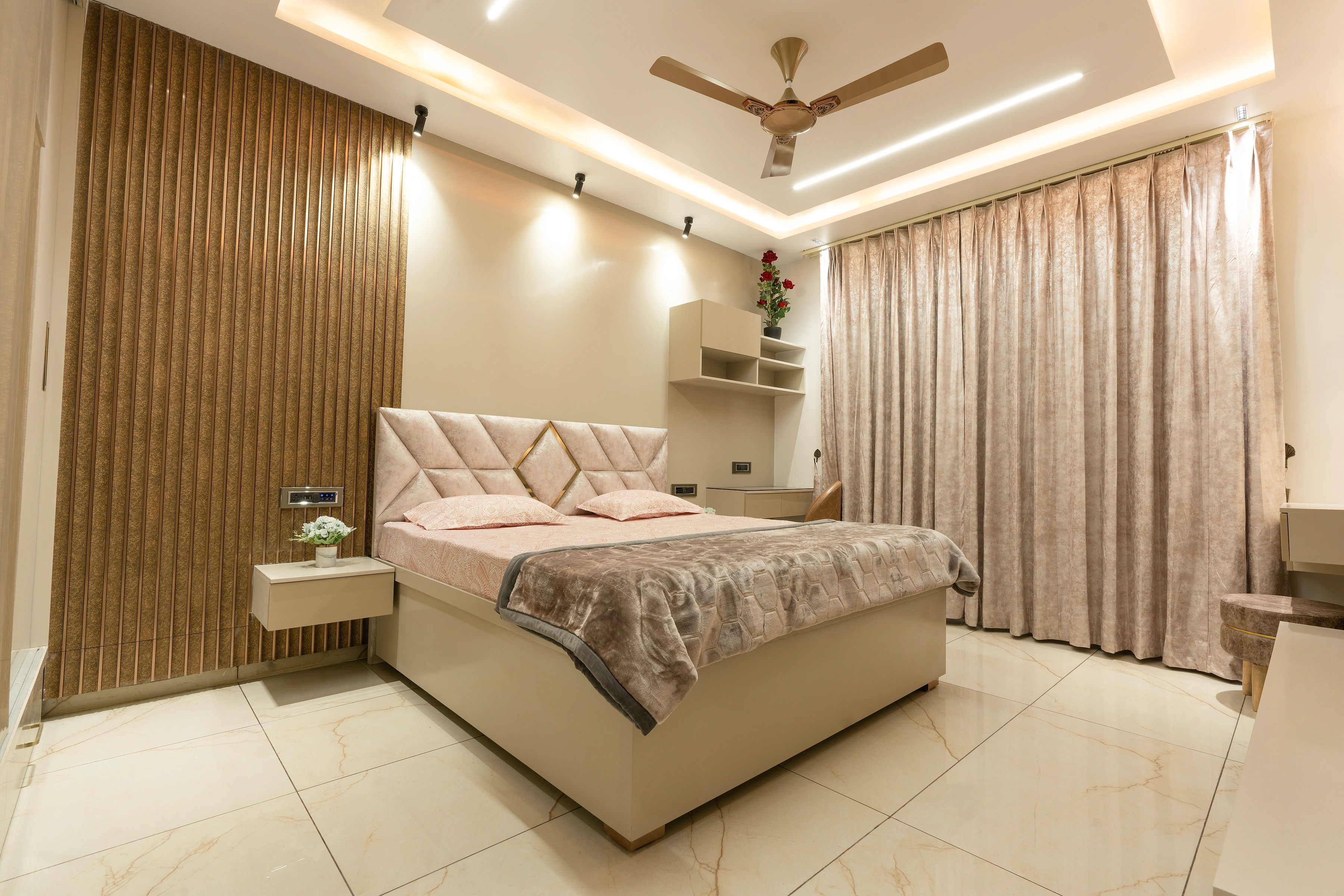 Wide view of a warm apartment bedroom